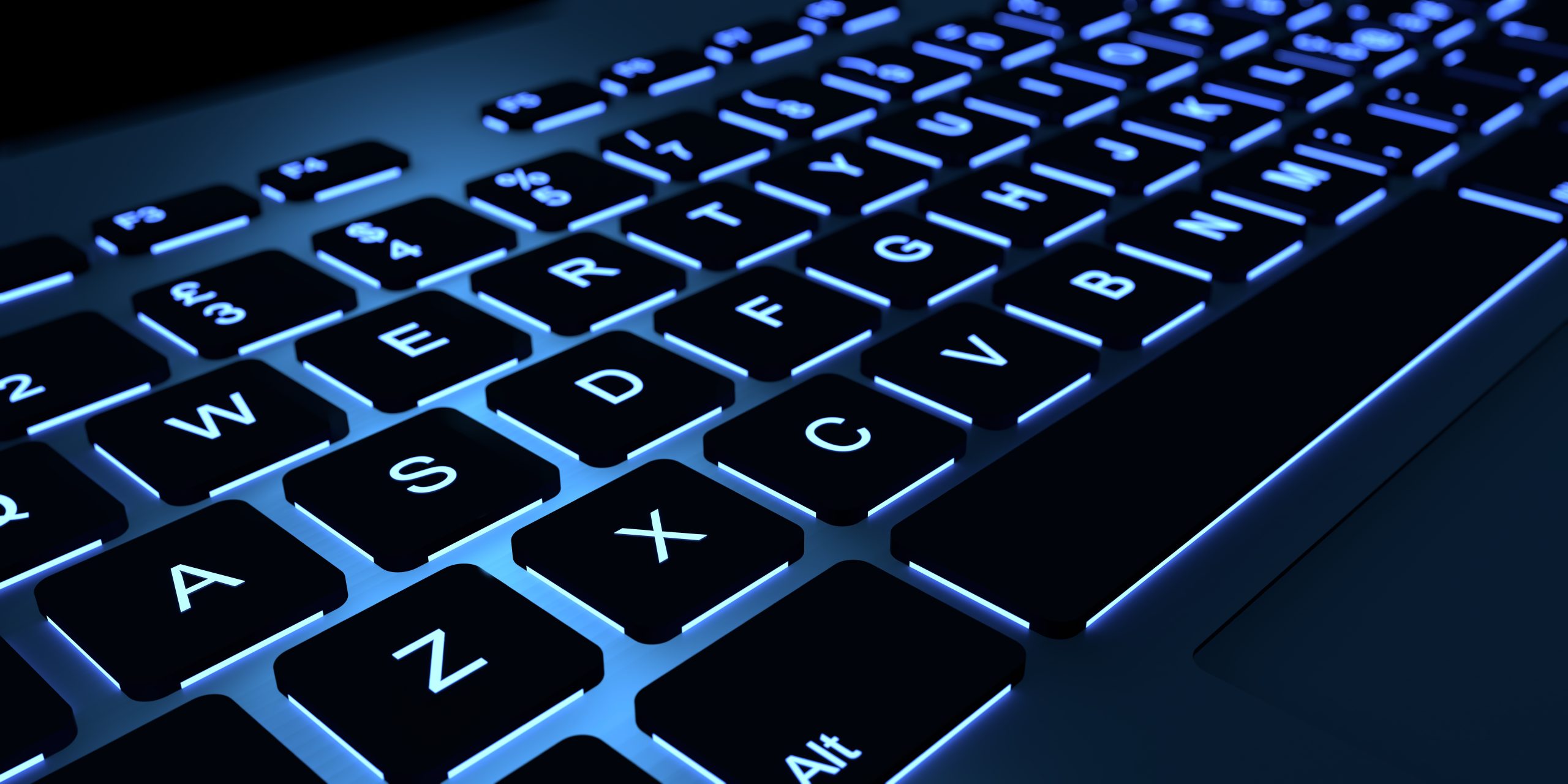 Computer keyboard with blue backlight.