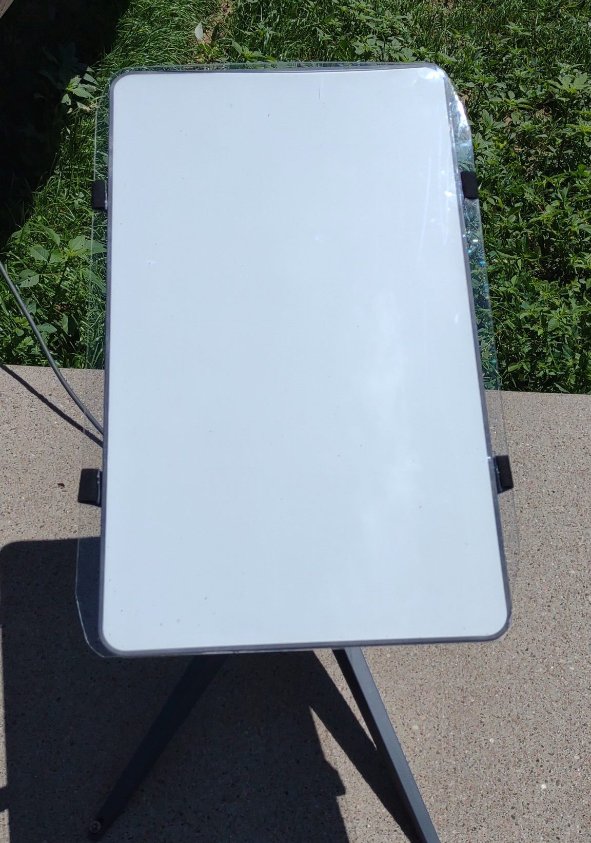 Front view of a Starlink Satellite with a satellite shield on it.